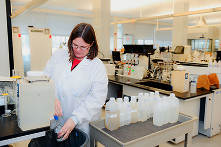 Female lab employee running tests in the current WSSC Water laboratory