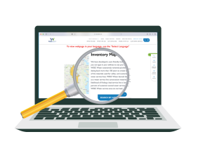 laptop with map and magnifying glass