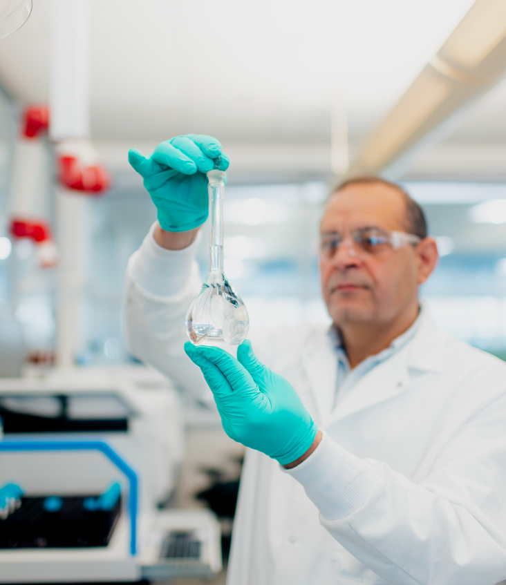 Ashraf Gawargeyous, senior chemist observing water in a beaker