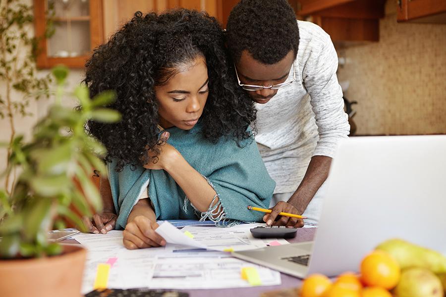 african american husband helping his wife