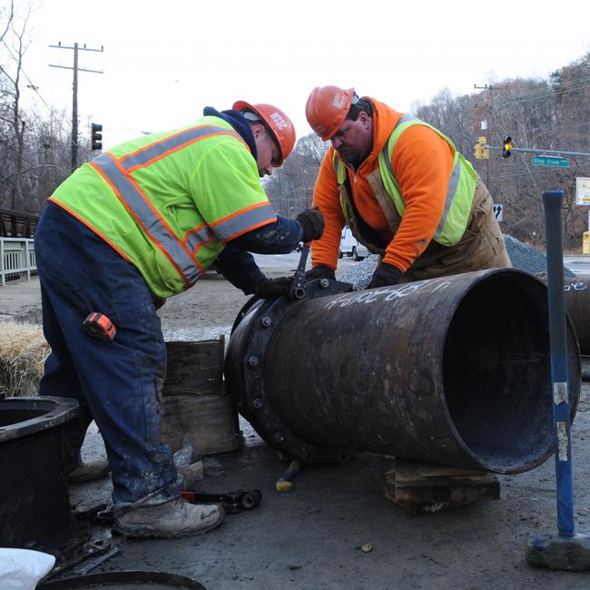 WSSC Water Utility Services crew working on a pipe