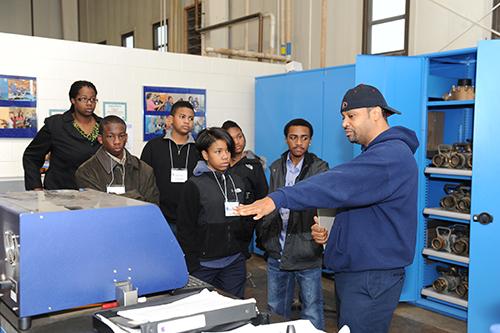 plant tour listening to employee describe process