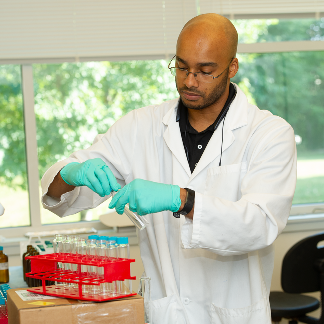 lab worker testing water samples