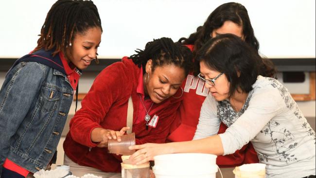 WSSC Water scientist working with girls on a STEAM project