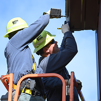 workers at the trade shop building