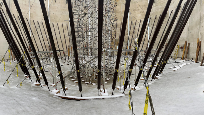 An inside view of one of the tall round digester tanks