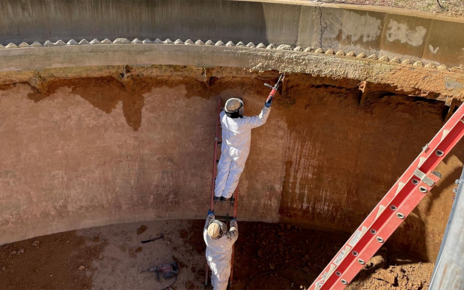 Workers are cleaning up existing gravity thickeners to be repurposed for this project.