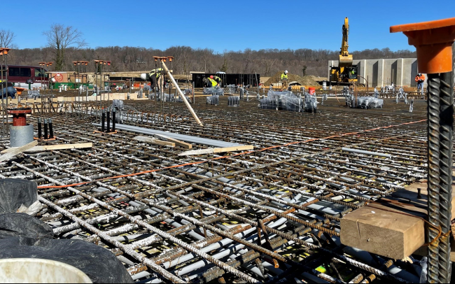 Workers are preparing for the slab pour at the Solids Building (one of two slides)