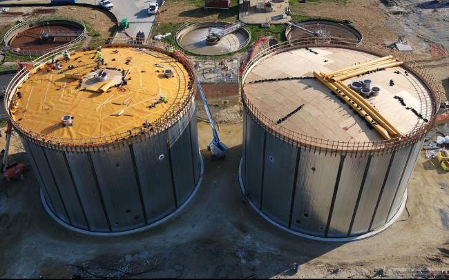 Close-up view of the Anaerobic Digesters.  Workers are putting the formwork in place in preparation of pouring the dome tops.  The tank on the left already has the liner installed.  On the right you can see the liner material is still rolled up.  We expect the tops to be poured in the next 2 weeks.