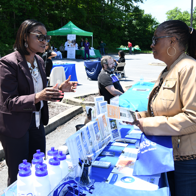Community outreach coordinator speaking with customer