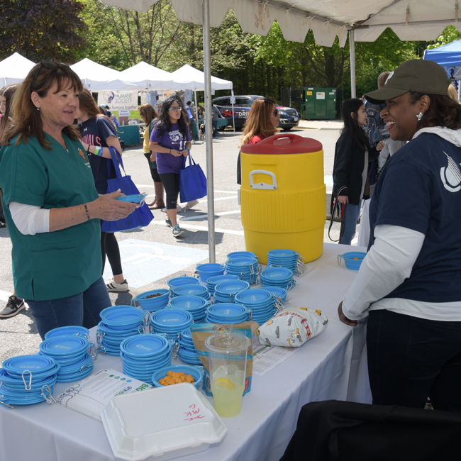 WSSC Water Volunteer working a table at a community event