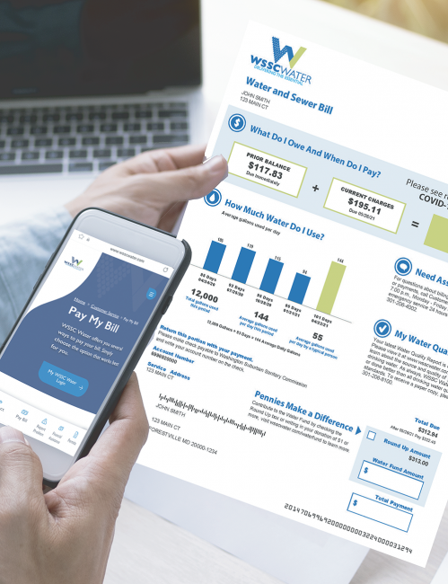 water bill with website on cell phone customer looking at it