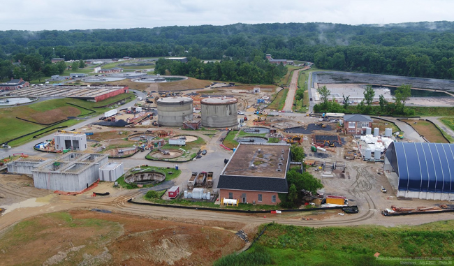 On the left you can see the new concrete walls on the Sidestream Treatment Building.  The Digesters are in the background.  Over on the right the blue canopy has been completed on the Final Cake Storage area.