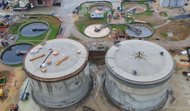 The Anaerobic Digesters with their dome roofs now completed.  They also have their final steel reinforcement and are waiting for their final shotcrete finish.  Above the Digesters are the 4 round clarifiers.  The empty one on the top right has new mechanical equipment which they’ll all eventually get.