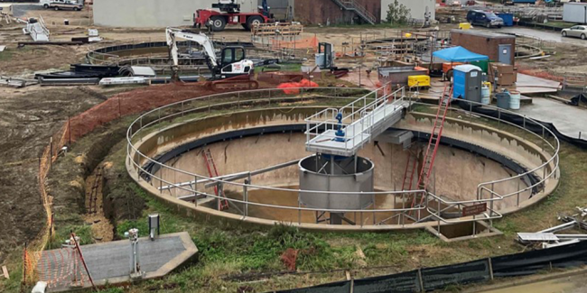 This is one of the existing Gravity Thickeners.  It’s a big tank where the solids settle to the bottom and are removed.  The Contractor has installed new mechanical equipment and a railing on the perimeter.