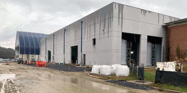 The new Solids Building from the backside view.  The roof construction is complete and you can see the downspouts are working – but not finished yet.