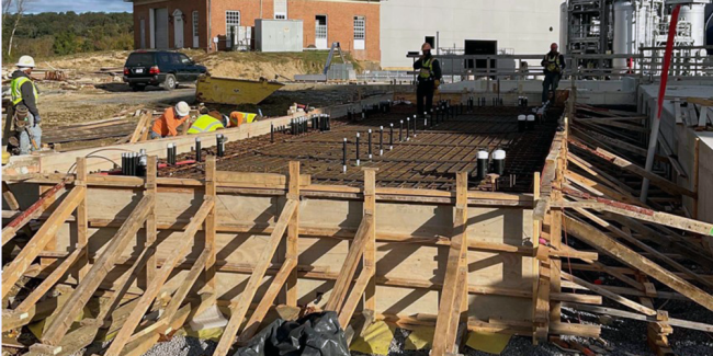This is the slab for the Electrical Building next to the Cake Receiving Area.  The pipes sticking up through the steel rebar are conduits that will be housing the electrical wiring which will be connected to motor controls and other electrical equipment in this building.