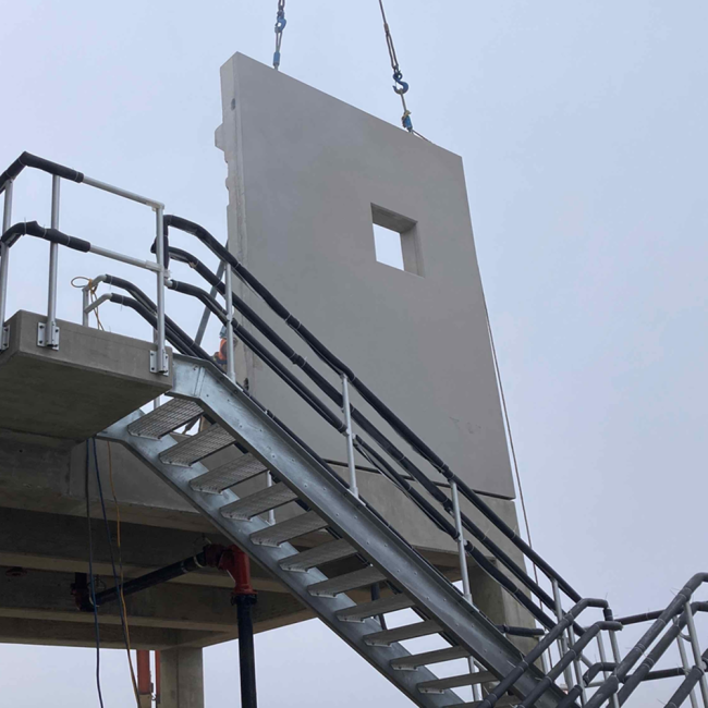 The Contractor is putting the precast wall panels in place on the Screenings Facility on the back side of the Solids Building.  The screening equipment that will be inside this facility will be used to screen out the larger particles from the sludge before it goes through the Thermal Hydrolysis (Cambi) Process.