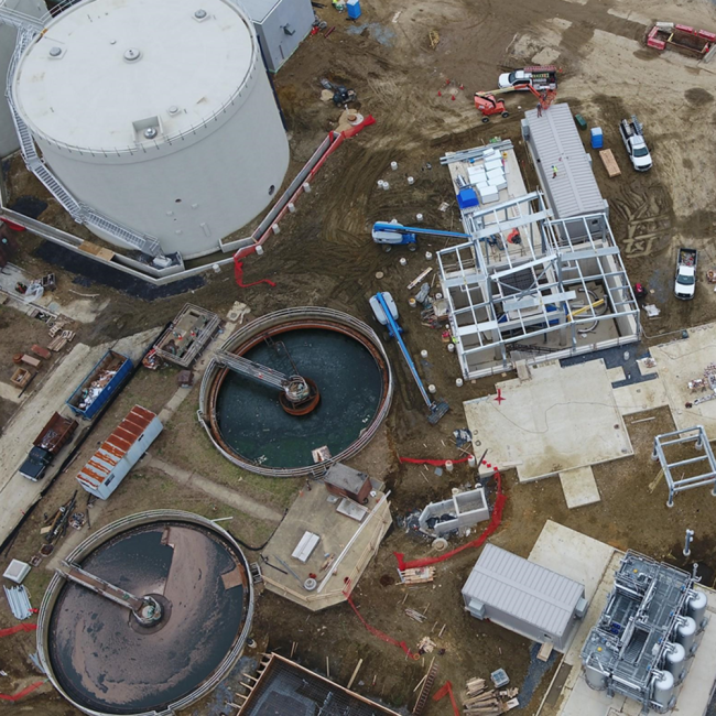 Overhead view of the Cake Receiving Facility showing the structural steel framework of the building.  The two concrete pads below the facility are for the Cake Storage Silos which have not been delivered yet to the site.
