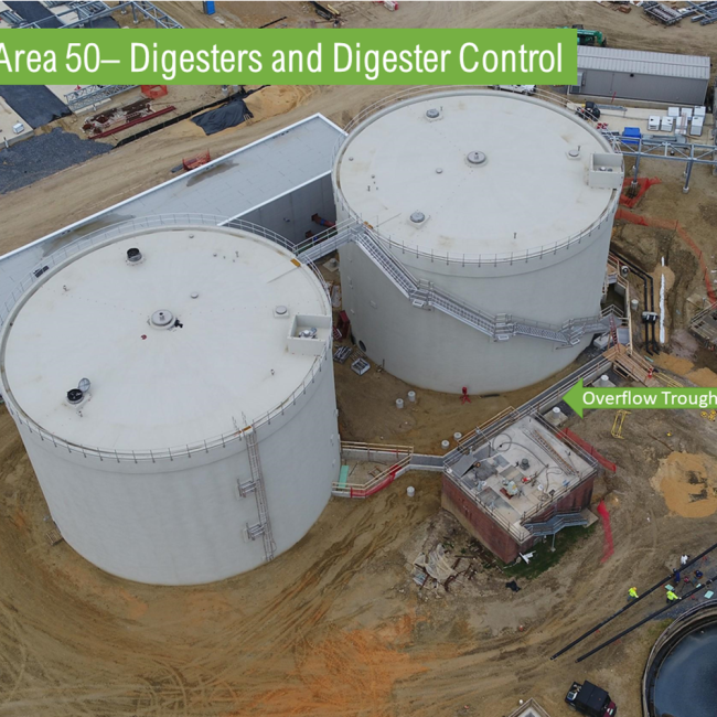 Aerial view of the Anaerobic Digesters.  The stairs and the connecting bridge have been completed.  The overflow trough is nearing completion.  Progress continues inside the structures with piping and mechanical work.