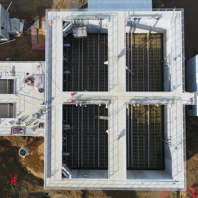 Direct overhead view of the Sidestream Treatment Facility looking down inside the reactors.  The safety railings around the top of the structures were completed this month.