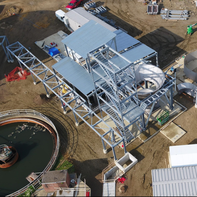 Aerial photo of the Cake Receiving Facility.  The stair tower is nearing completion and work has started on the storage silo next to the stairs.  Within the next couple of months both storage silos should be completed.