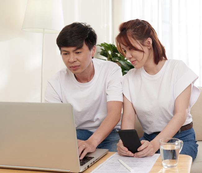 asian couple managing finances