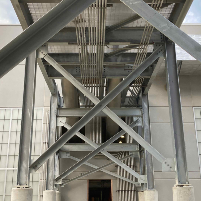This is the underside of the Conveyor Bridge that runs between the Solids Building and the Class A Biosolids Storage Facility.  The steel conduit is carrying the electrical and control wiring.