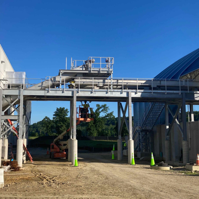 The conveyor transports the final Class A Biosolids from the Solids Building on the left.