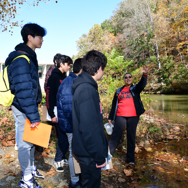 students at the water's edge learning about source water protection