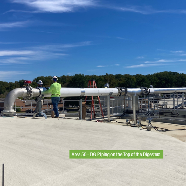 This photo is taken on top of the Digester.  Workers are putting insulation on the digester gas piping.