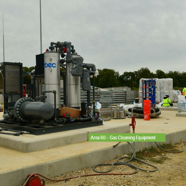 On the concrete pad is pumping equipment on the left and gas conditioning equipment on the right.