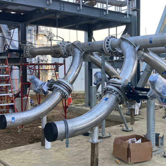 Construction in progress on the discharge piping from the Cake Receiving Facility.