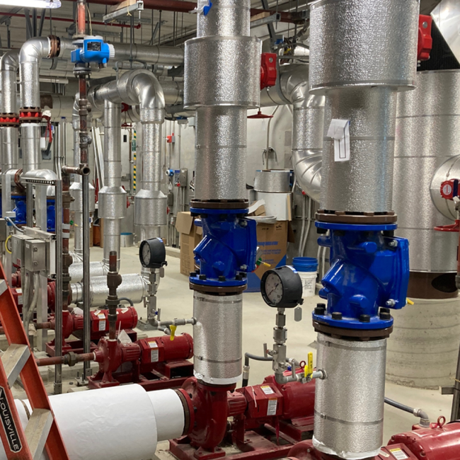 The extensive pipe network inside the Medium Temperature Hot Water Building is currently being tested.