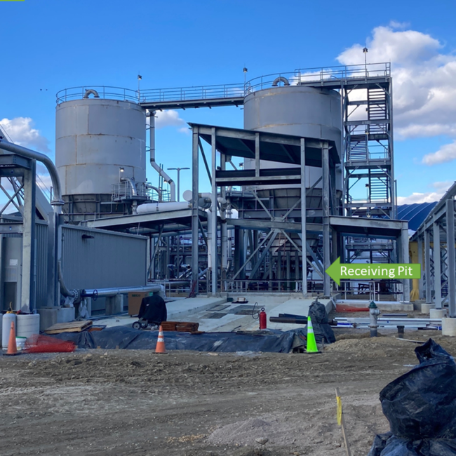 Trucks delivering the solids produced at the other plants will bring them here to the Cake Receiving Facility.  The trucks will back down the pad shown here and dump the solids into the receiving pit which is directly below the structure with the slanted roof.