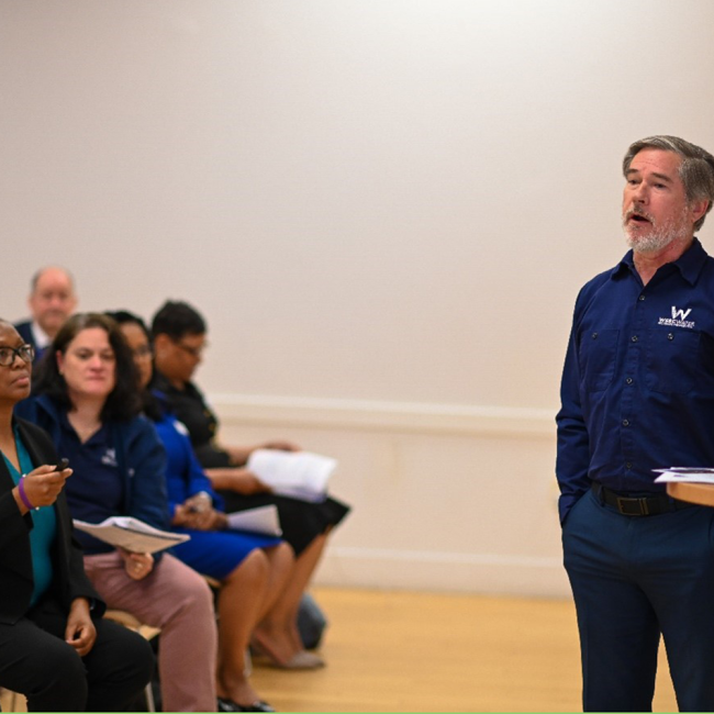 Ian Shaffer, Sr IT Security Analyst, talking with attendees in a breakout session.