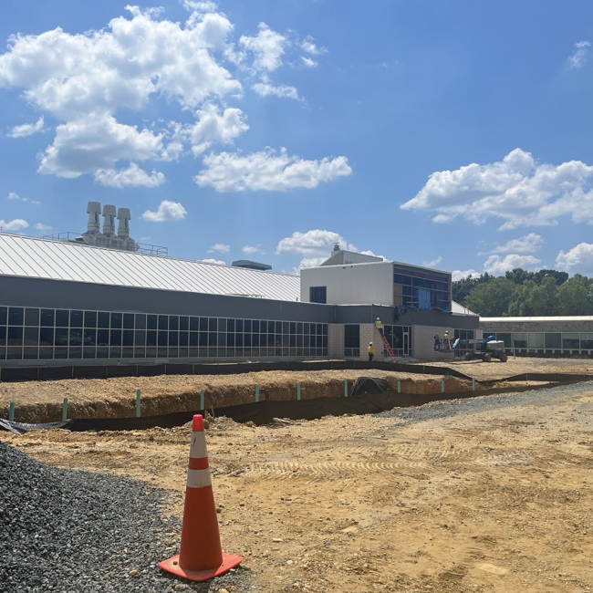 North elevation of the new expansion and retention pond