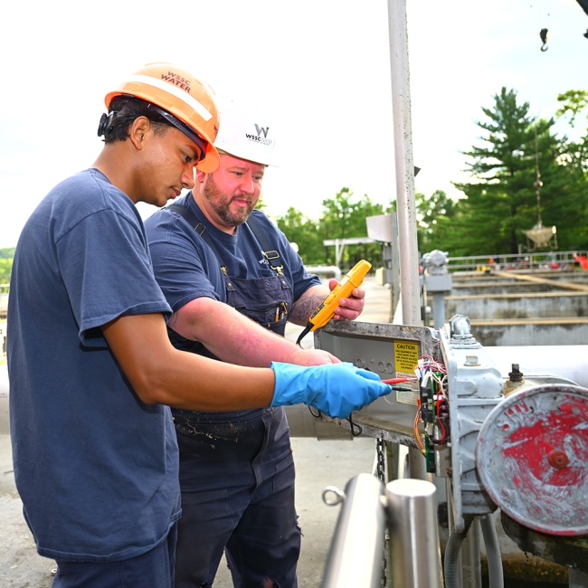 Intern learning about electrical wiring