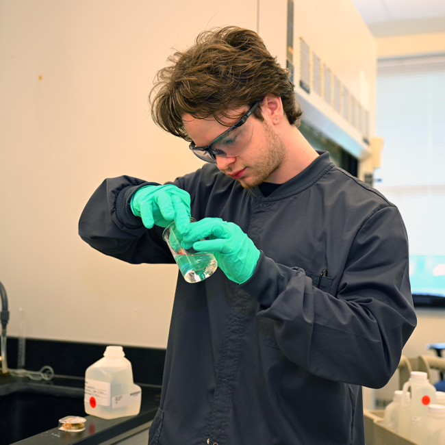 Lab intern testing the ph of the water