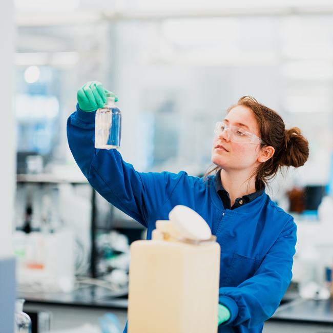 Kimberly Brackett testing water samples at the lab