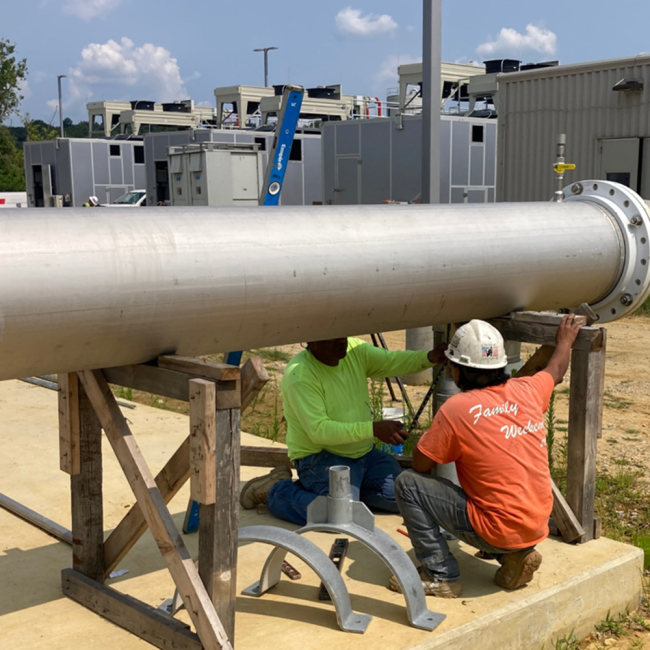 Working on the assembly of the Digested Gas pipeline at the Gas Treatment Facility.