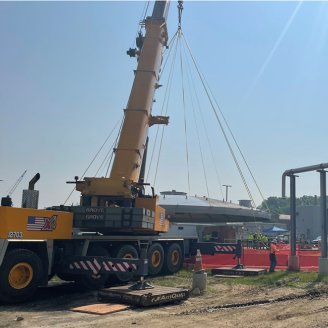 Contractor is placing the dome cover on top of the Digested Sludge Storage Tank.