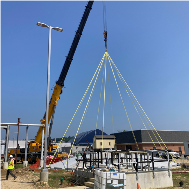 Contractor is placing the dome cover on top of the Digested Sludge Storage Tank.
