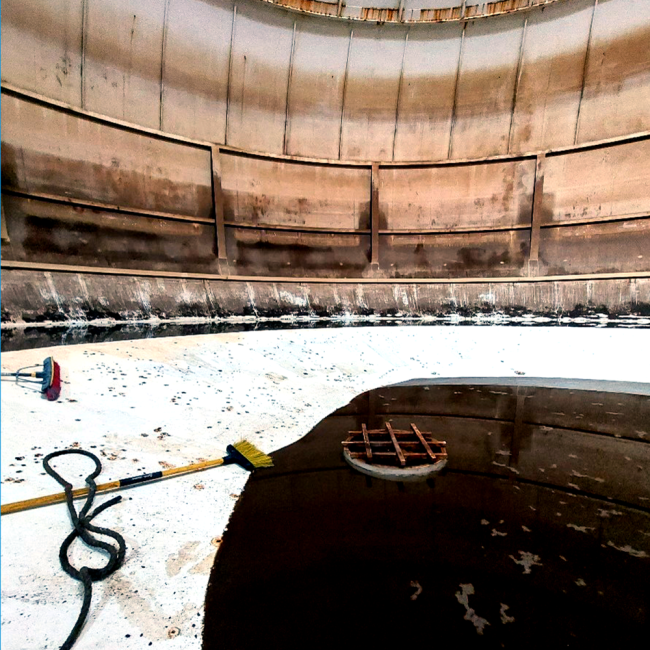 Tank interior being power washed and cleaned prior to the coating process beginning.