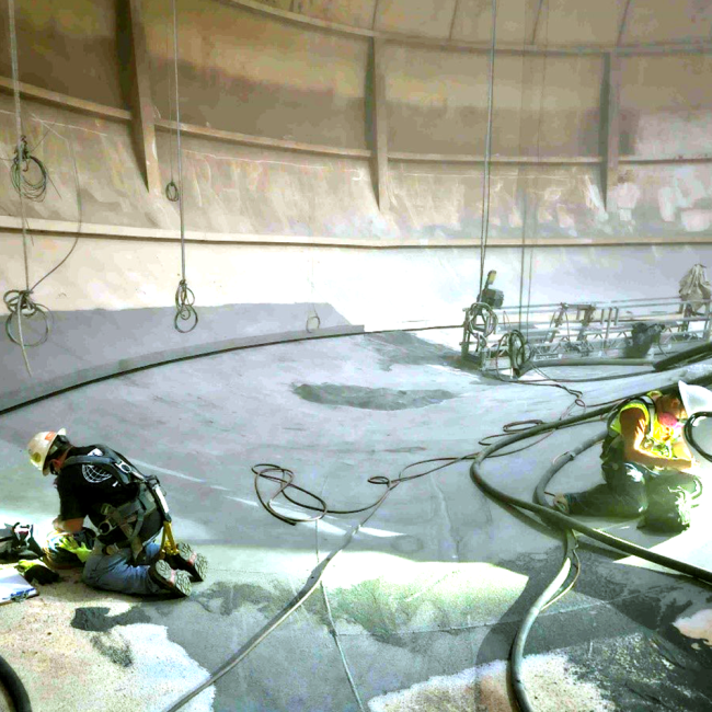 The interior of the tank being abrasive blasted to prepare the steel surface for the new coating system.  