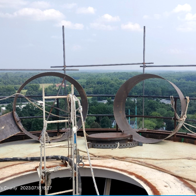 Installation of containment system bracing to allow for full enclosure of tank installation to contain dust from blasting the tank and overspray from painting.  New handrail system in compliance with OSHA requirements has also been installed.