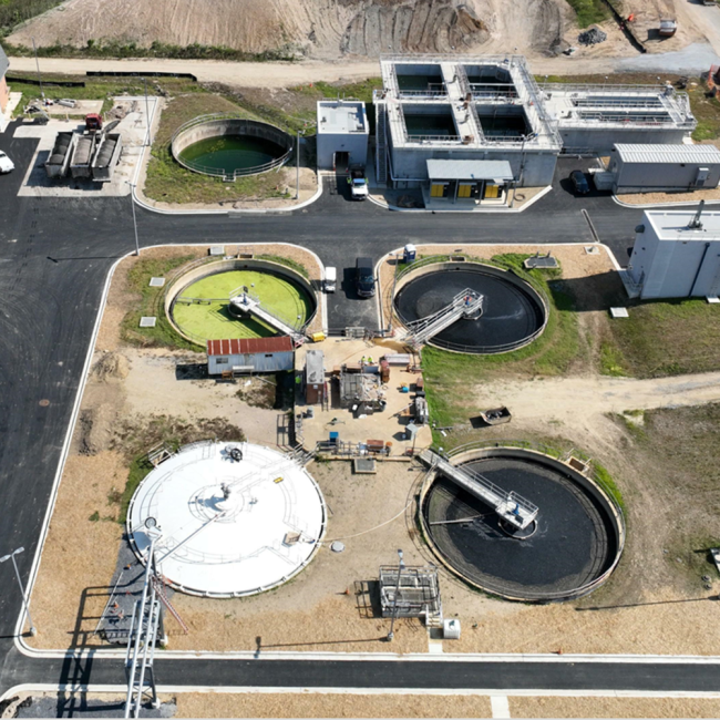 Aerial view of the gravity thickeners and the digested sludge storage facility with its new cover.