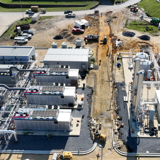 Road construction between the generators on the left and the gas cleaning facility on the right.