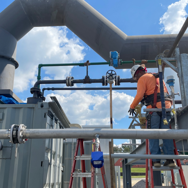 Steamfitter installing the piping on Boiler #3.