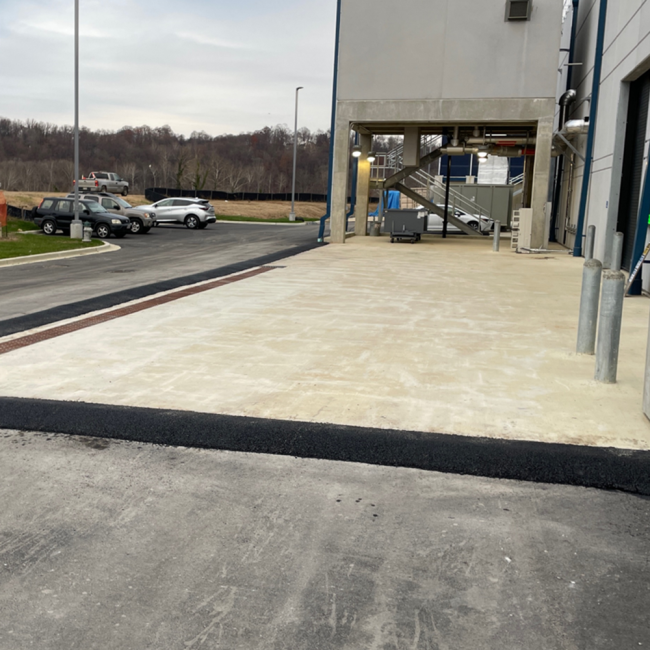 New rollover curb behind the Solids Building to control runoff.